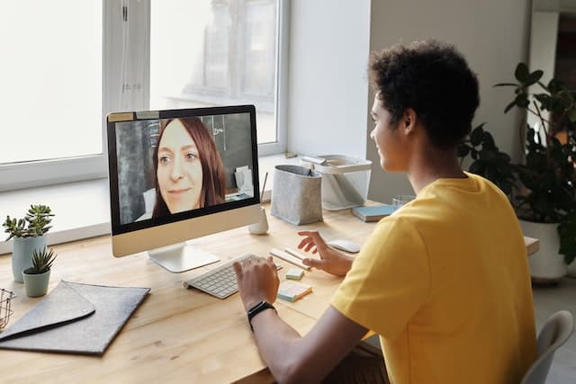 Student in a live 1:1 online Python tutoring session with a tutor on the screen
