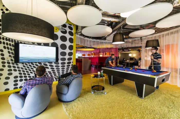 Developers working at a tech company with modern open-plan office